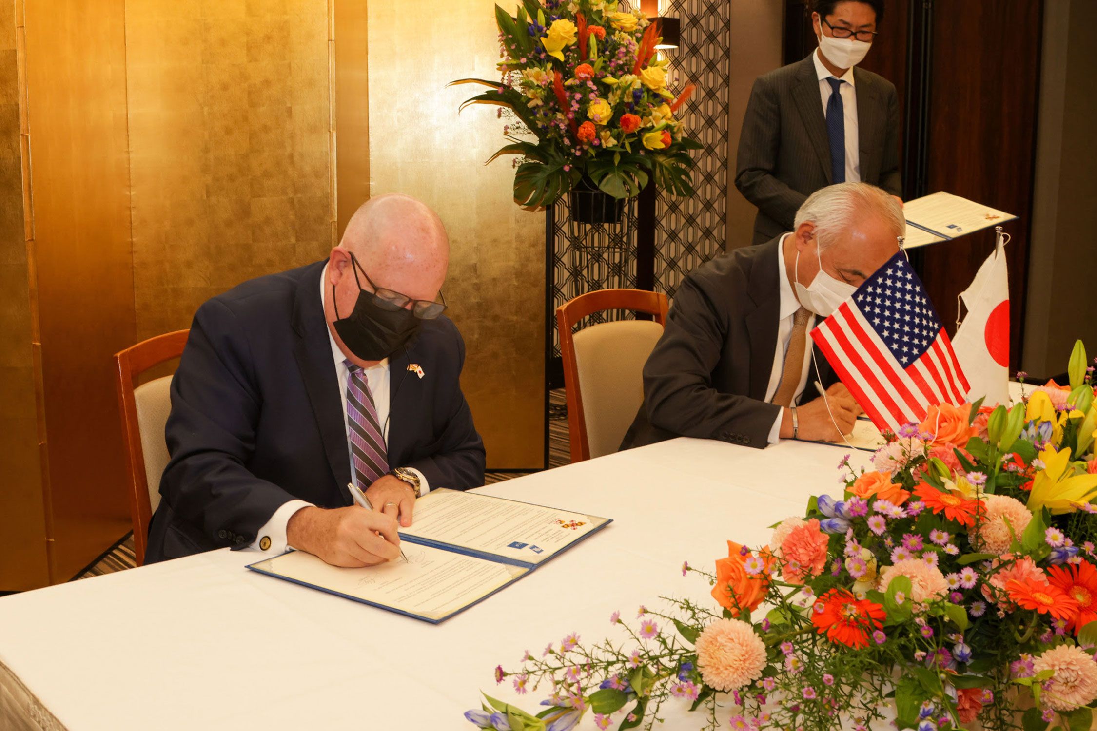 Maryland and Japan representatives signing written agreements