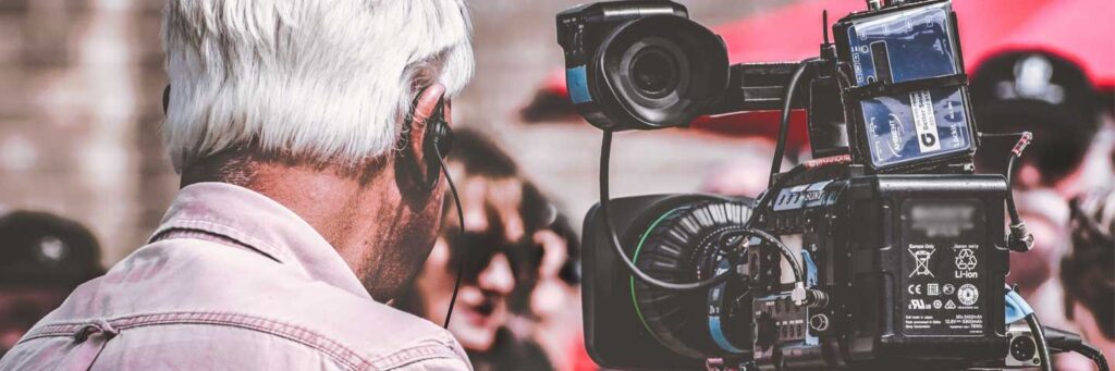 Man working with video recording equipment