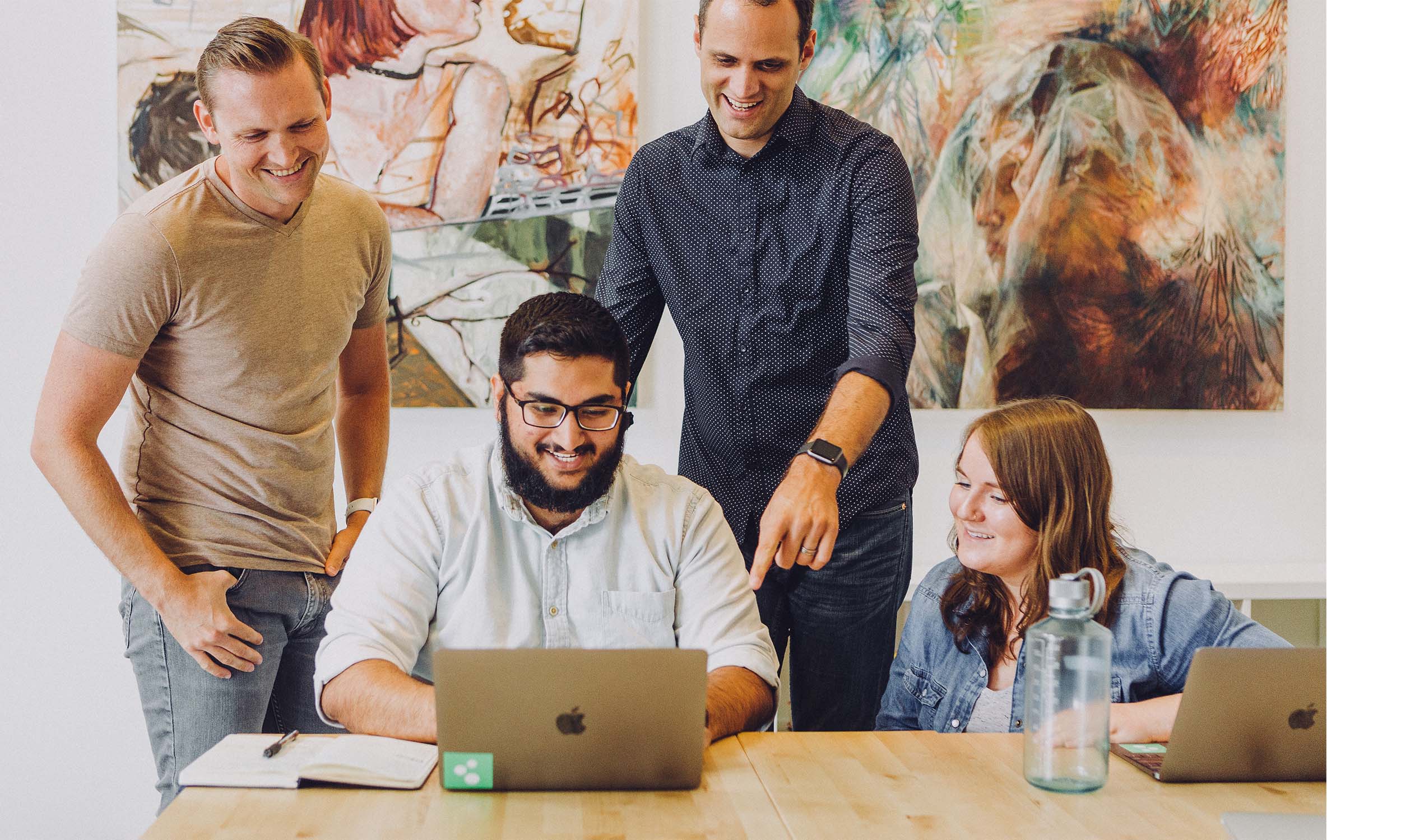 Professionals looking at a computer