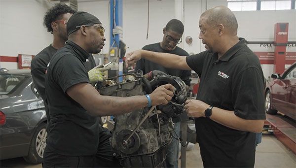 Men repairing a car