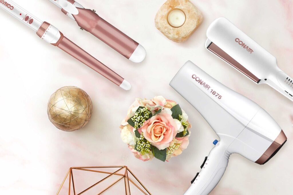 white and gold conair branded hair dryers and curlers