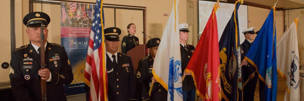Military members holding flags