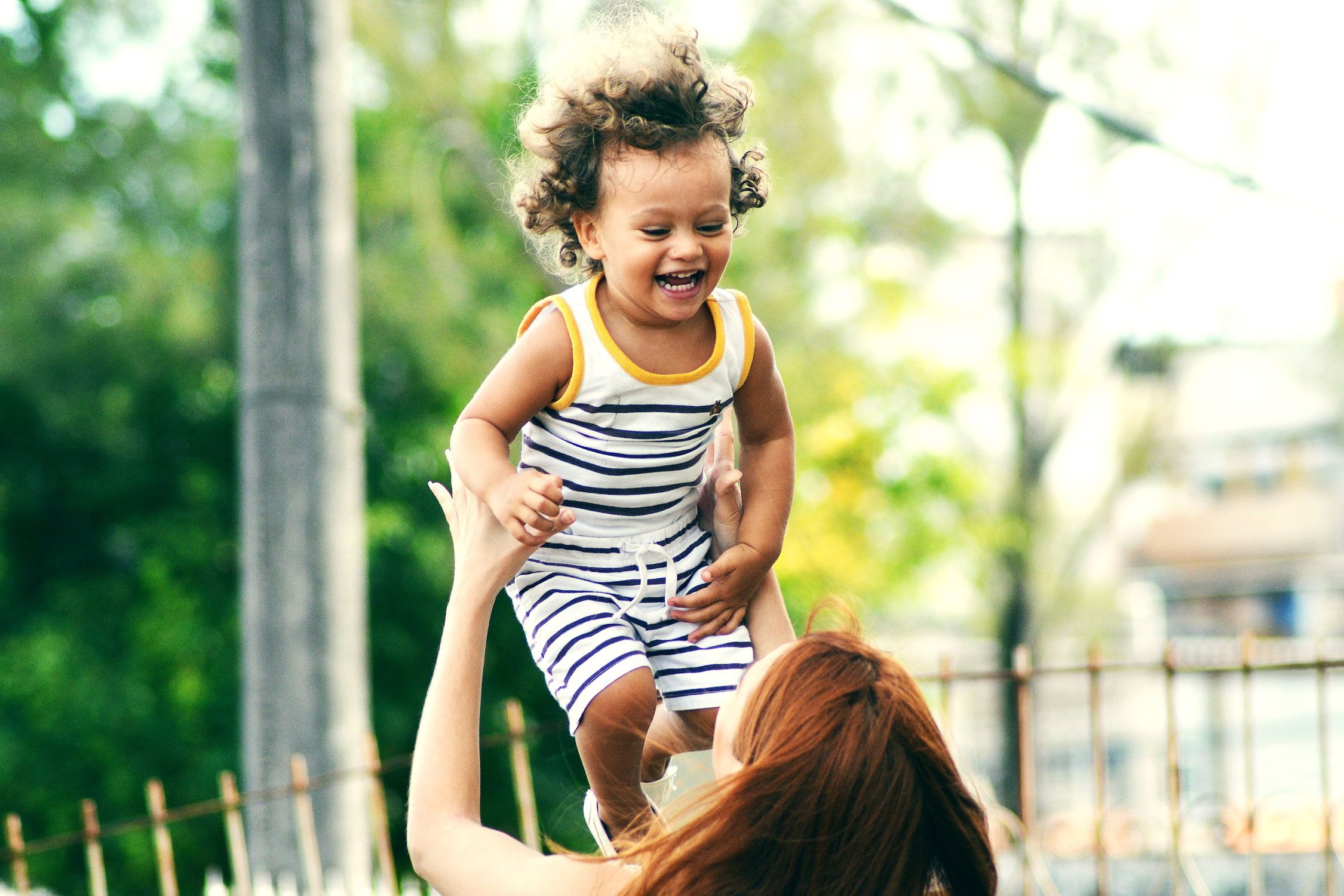 Child being thrown in the air for fun