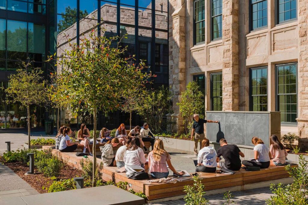 loyola university students in an outdoor classroom on campus