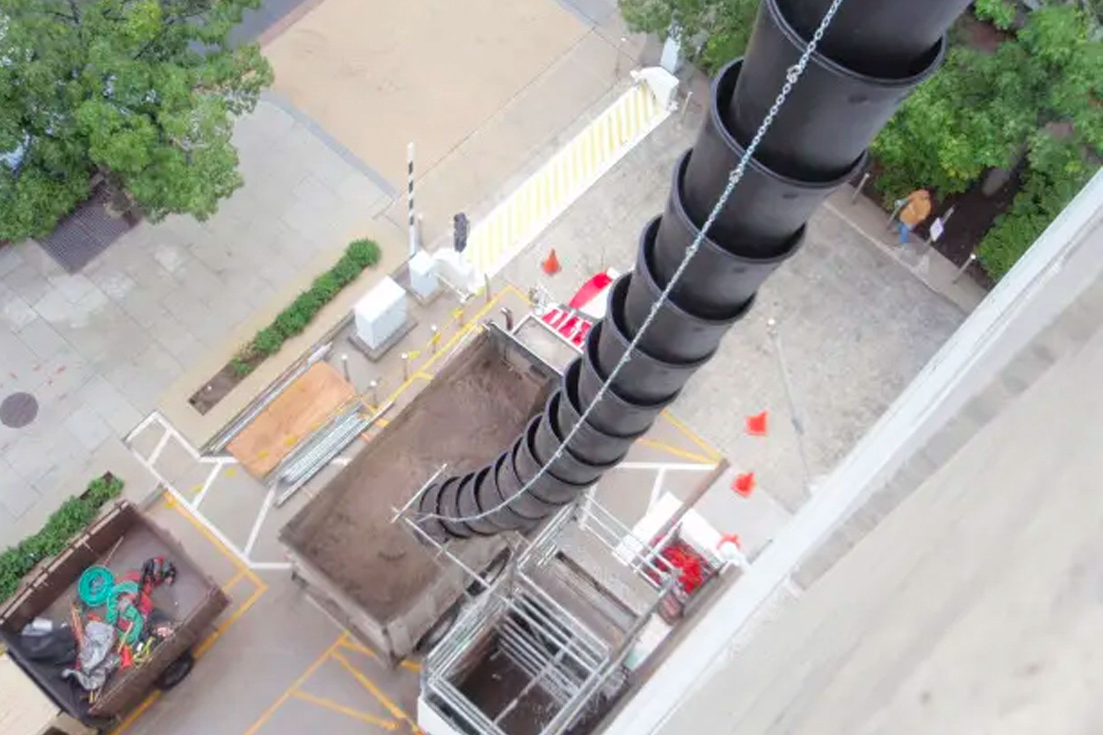Plastic chute outside a building