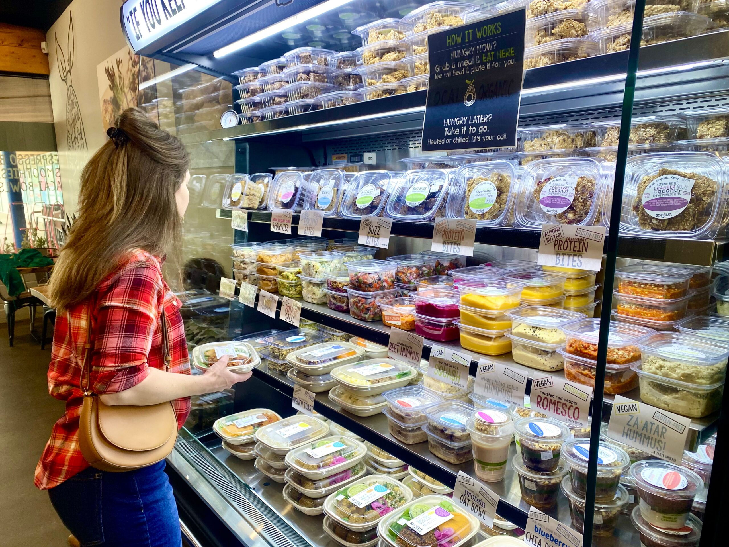 Image of customer picking out items at Eat Sprout 