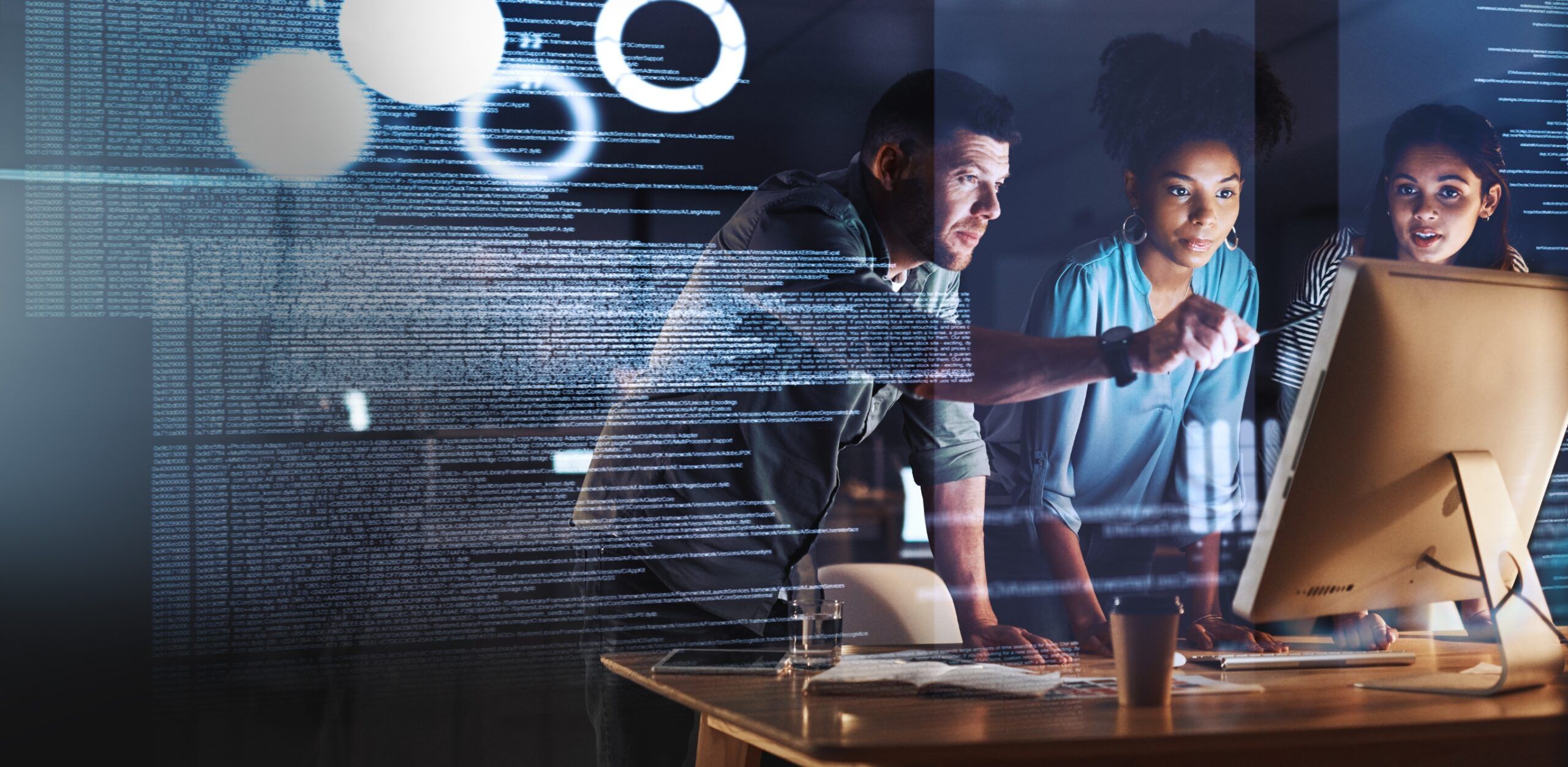 Group of professionals looking at a computer