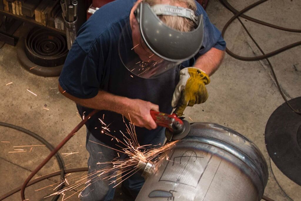 Man welding refrigeration equipment