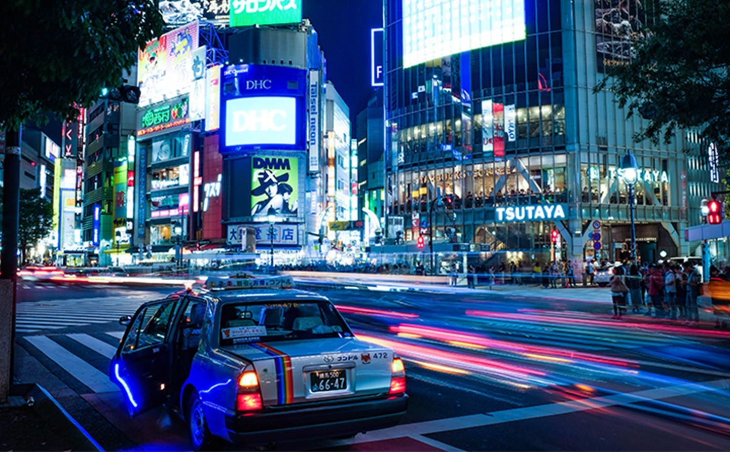 Night photo of international city with car lights lit up
