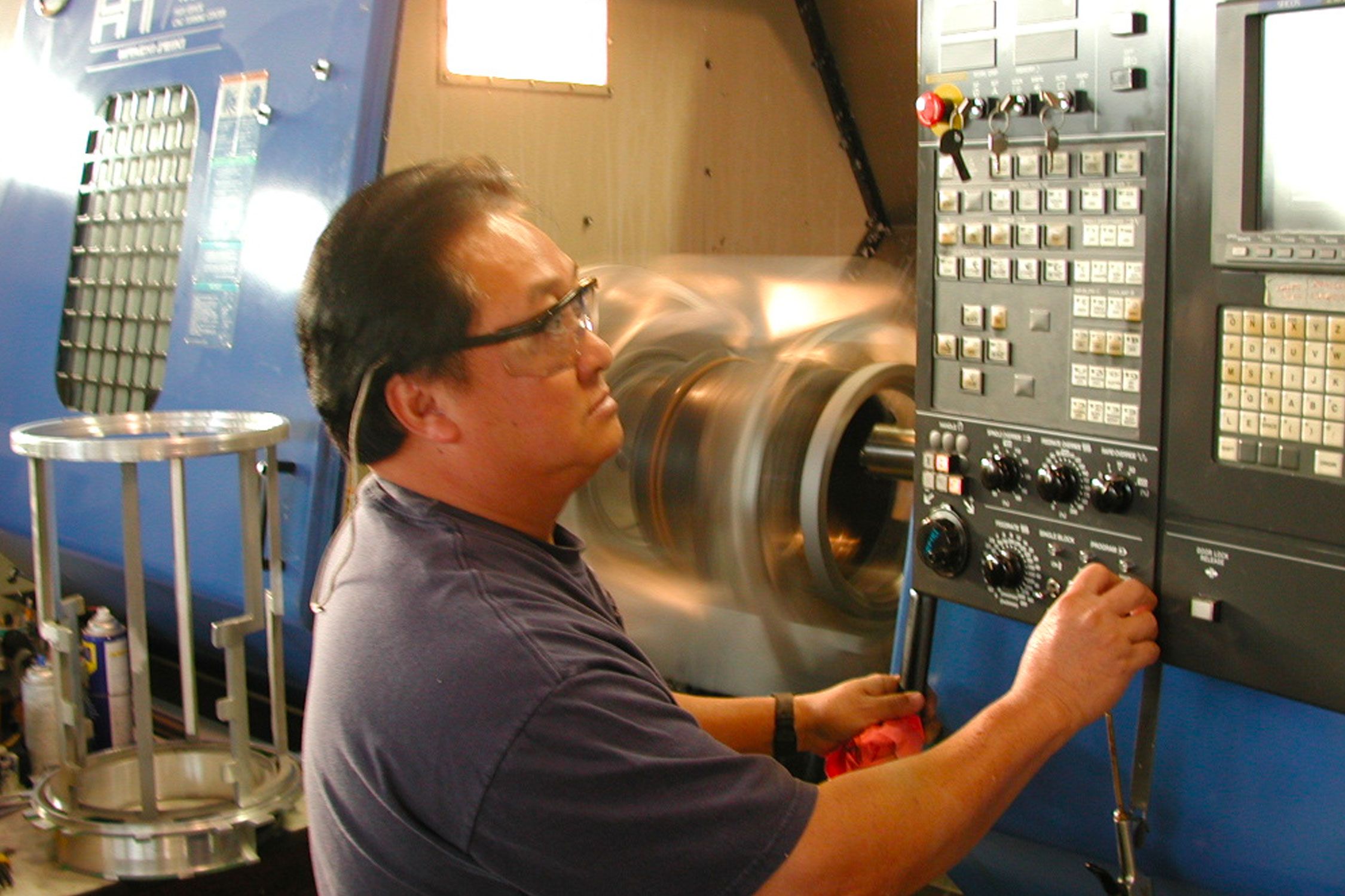 Man working with manufacturing equipment