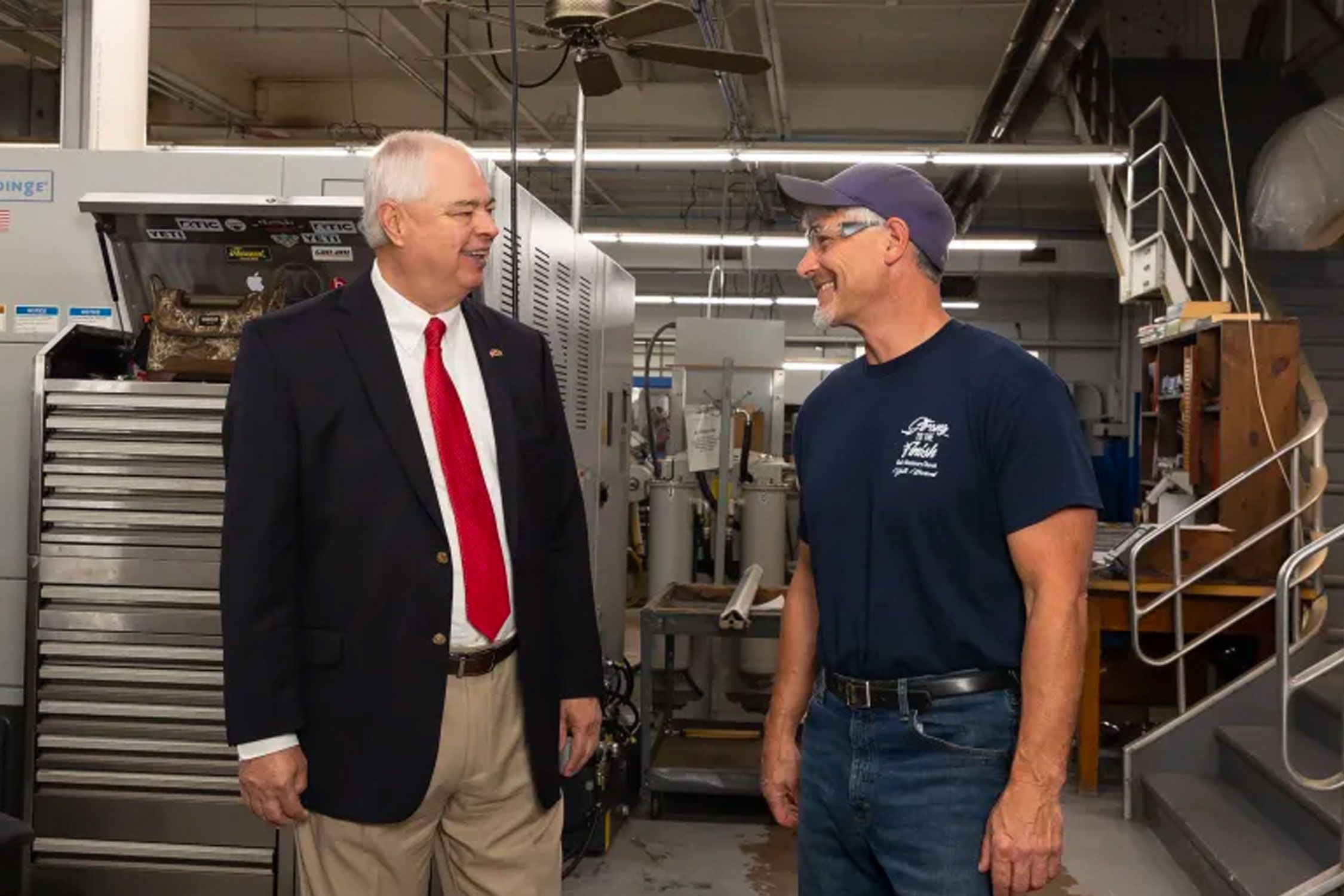 Men standing in industrial factory