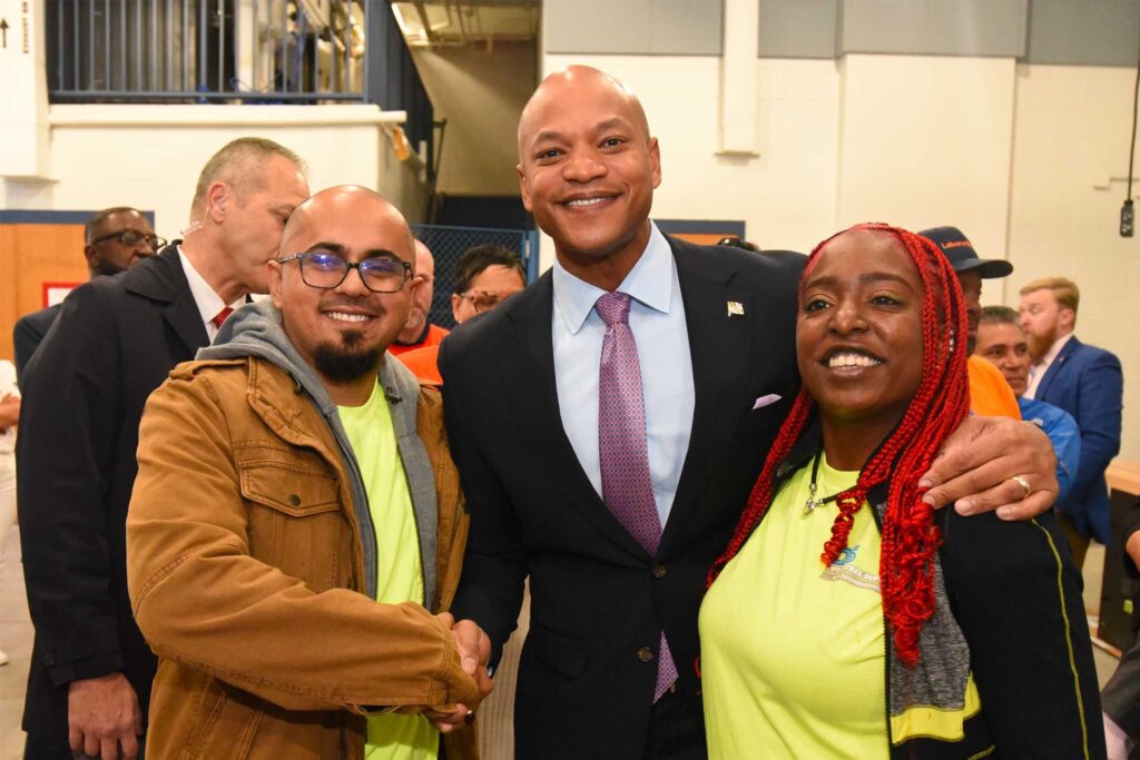 Governor Wes Moore takes a photo with transportation representatives