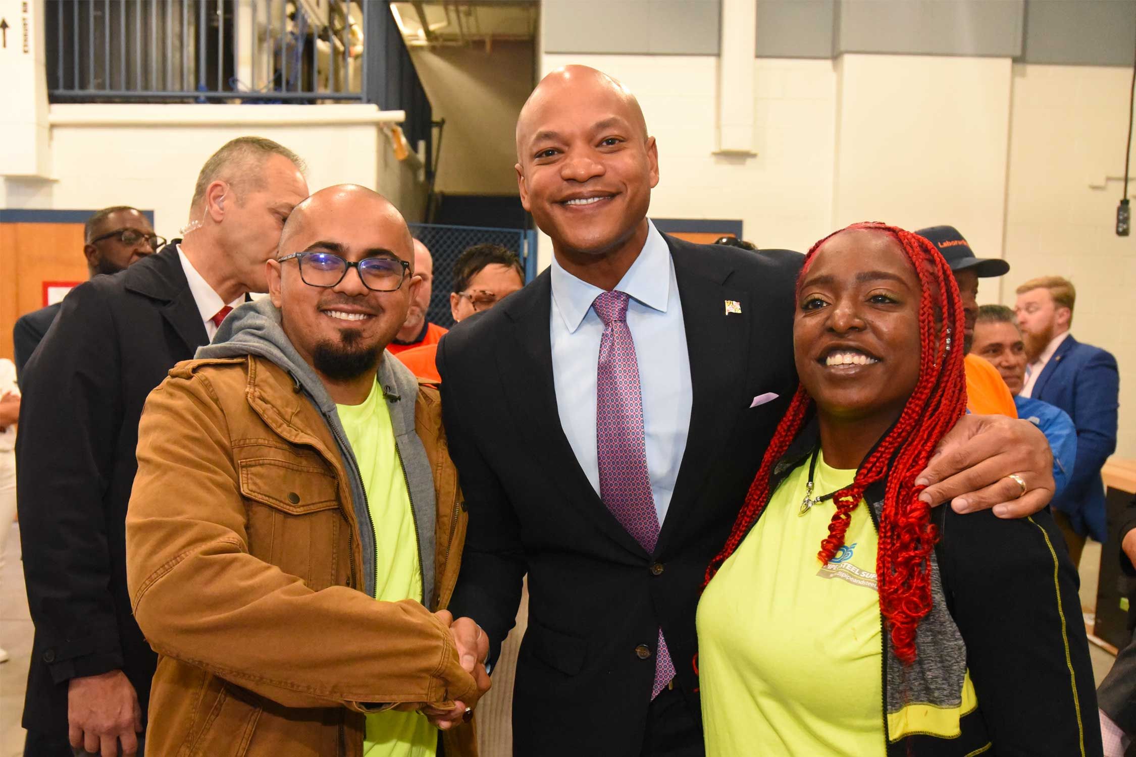 Governor Wes Moore takes a photo with transportation representatives