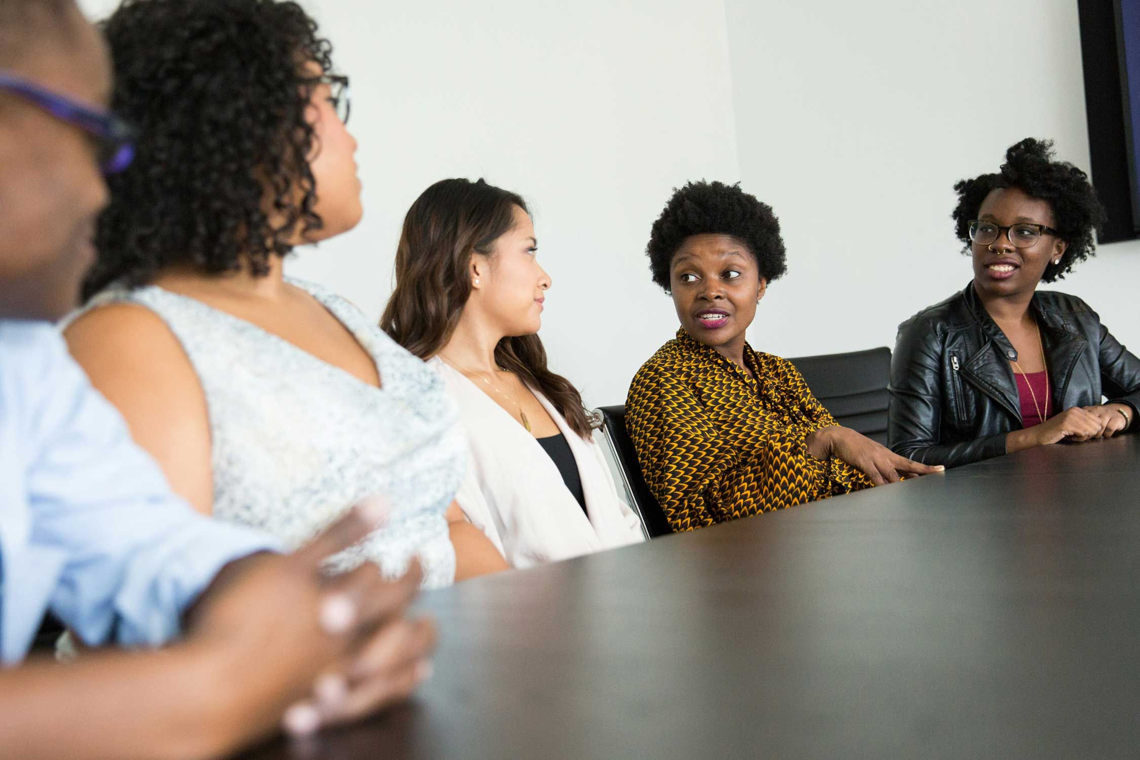 workers sitting at a conference table