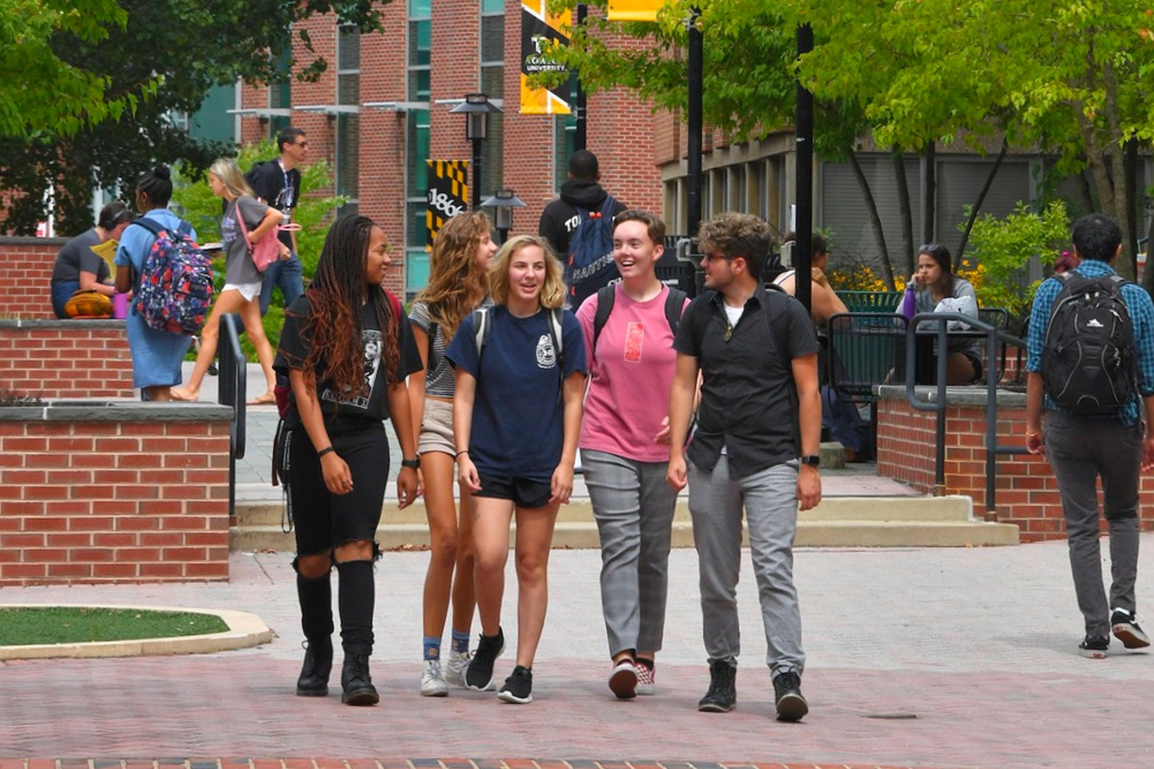 students walking outside on Towson University campus