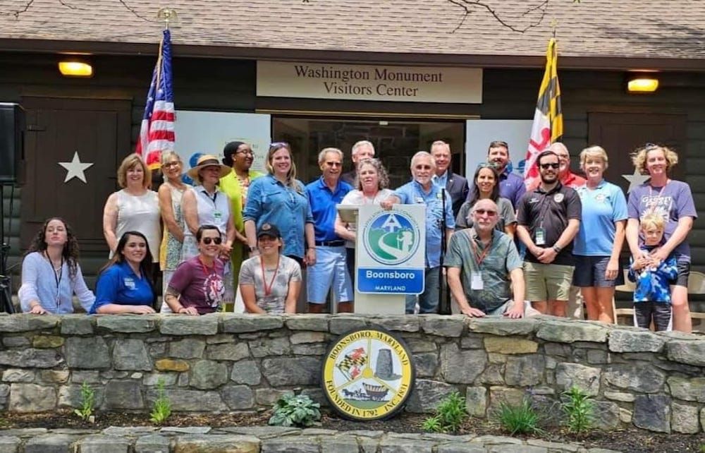 Group of people standing in front of Washington Monument Visitors Center in Boonsboro