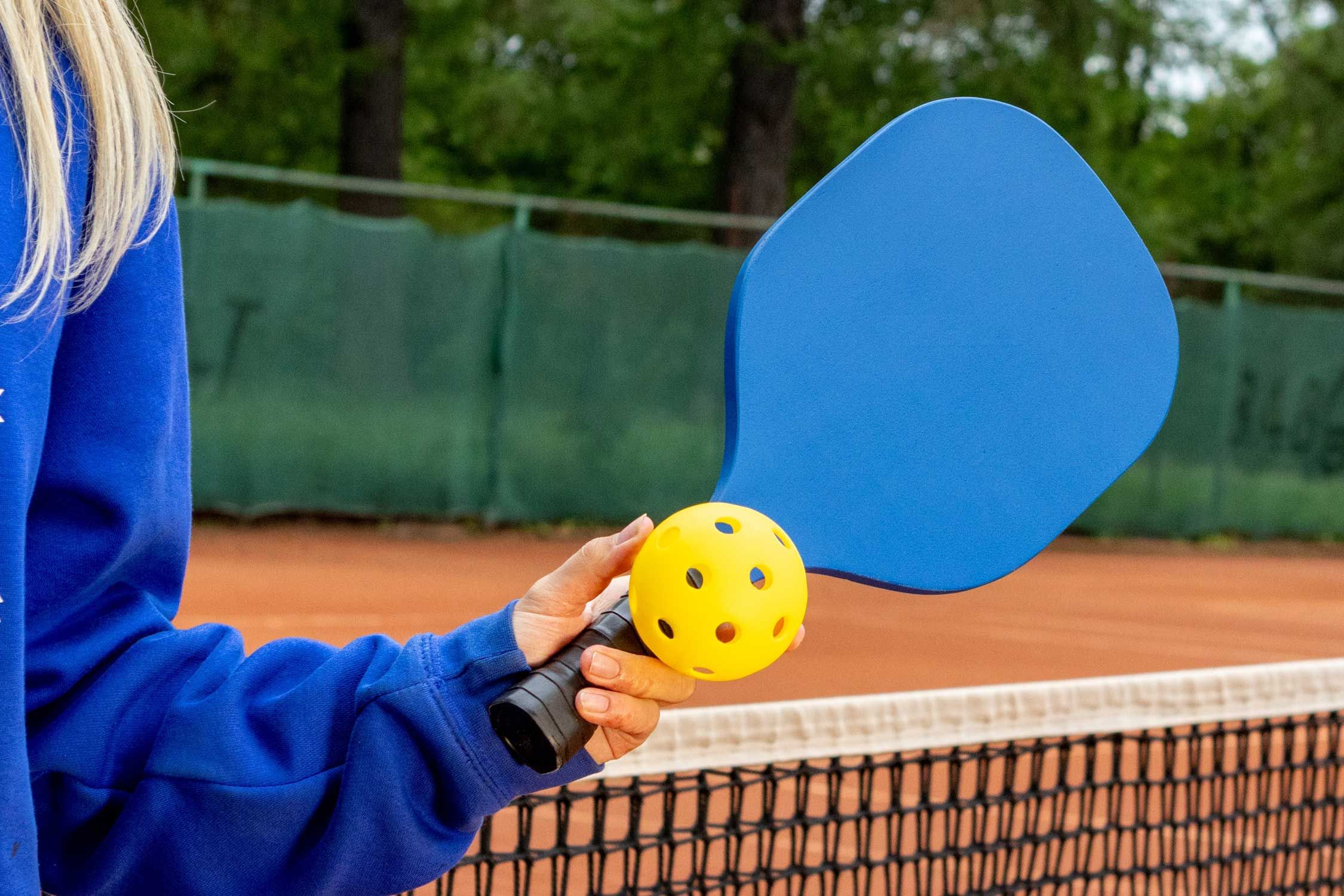A pickleball sport set featuring a paddle and ball