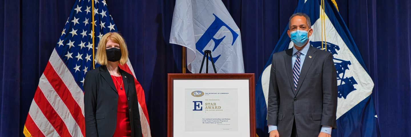 Two people standing at podium