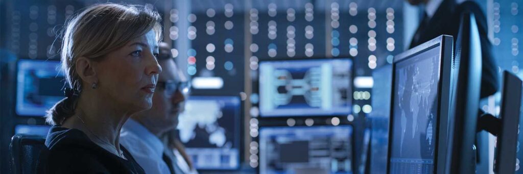 Cyber professional looking at computer