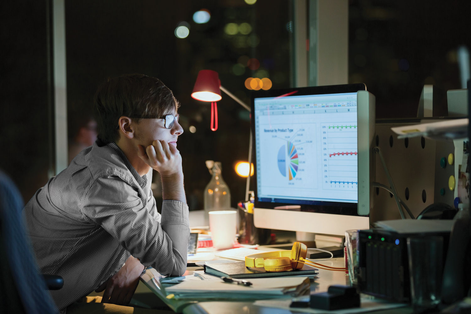 A person looking at data on a computer screen