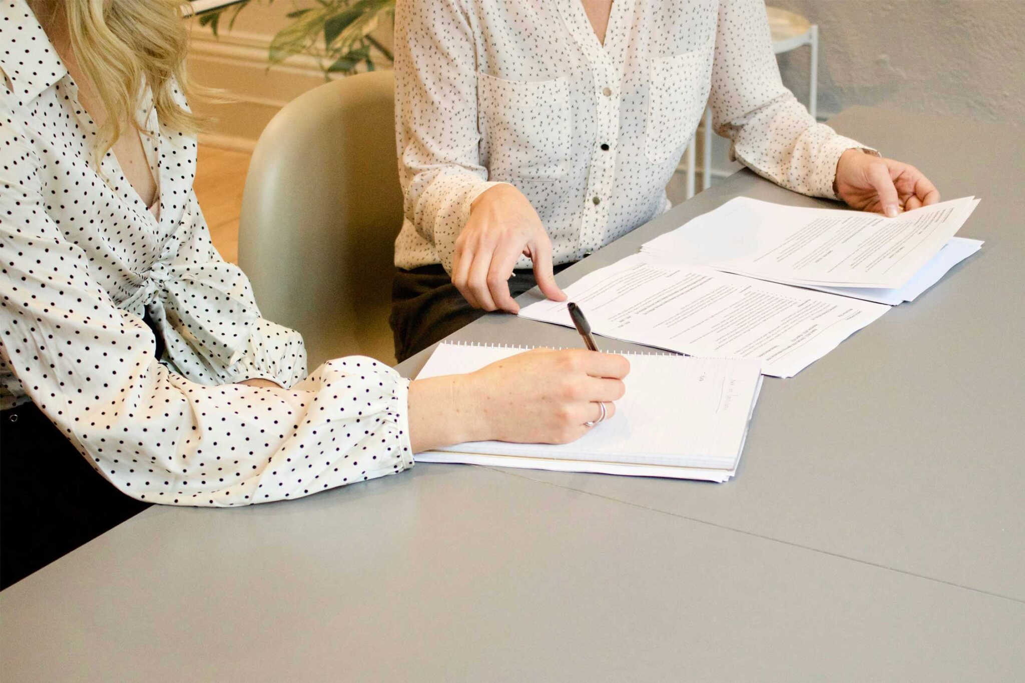 Two business women going over paperwork