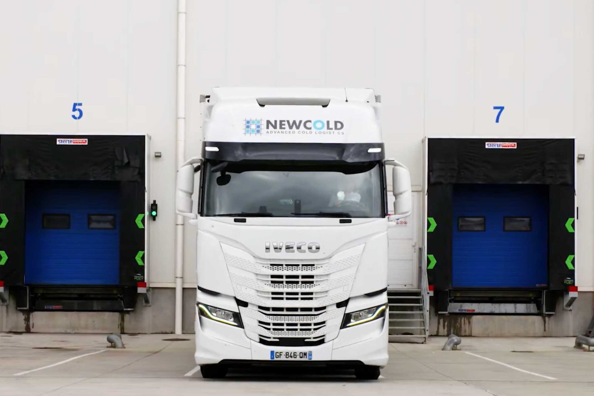 a white tractor trailer with the name NewCold