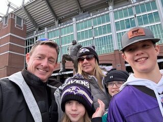 Tom Sadowski with his family at M&T Bank Stadium for a Raven's Game