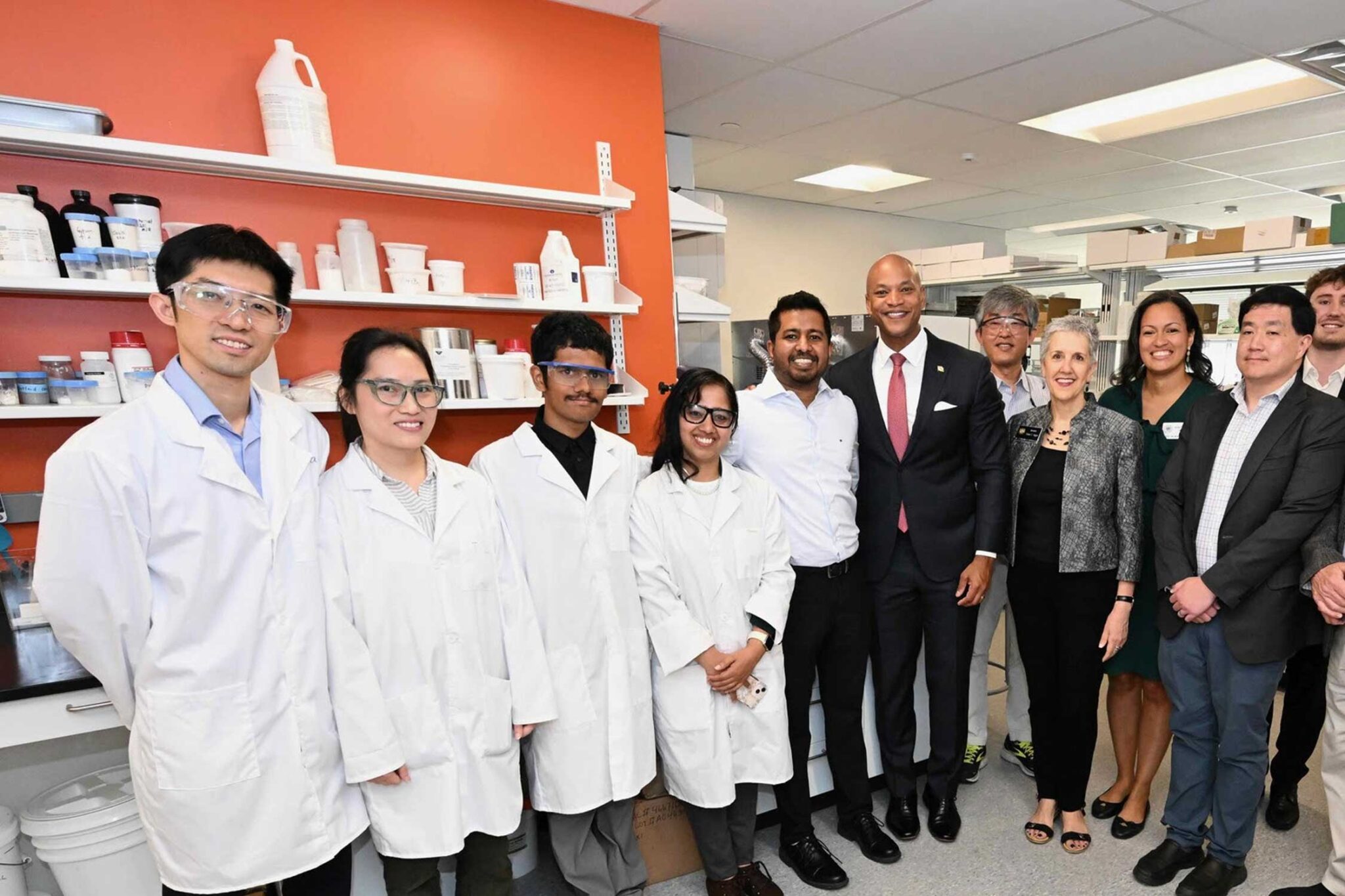 Governor Moore takes a photo with Liatris employees in its Rockville facility