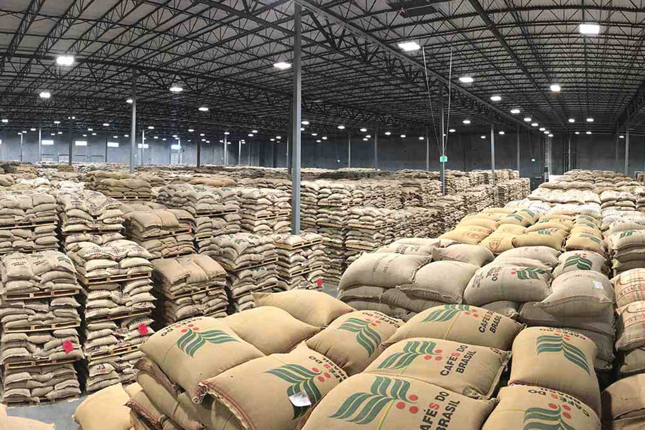 a warehouse full of sacks containing coffee beans