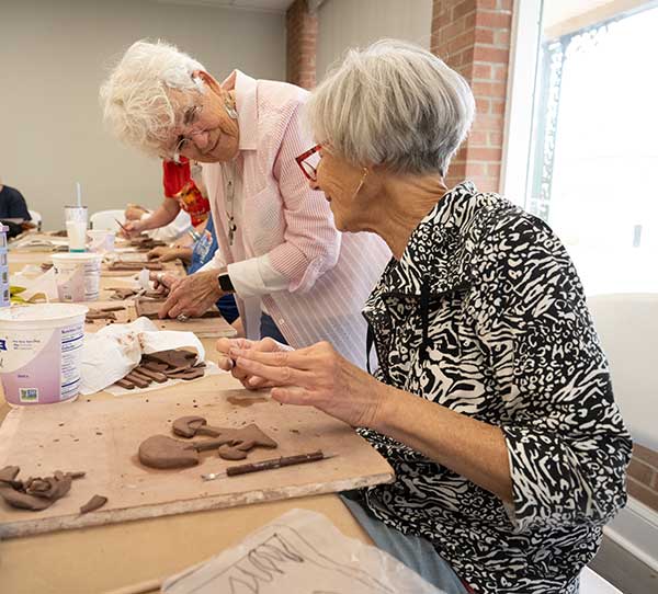 two women taking part in an art class at Kocen Arts Center