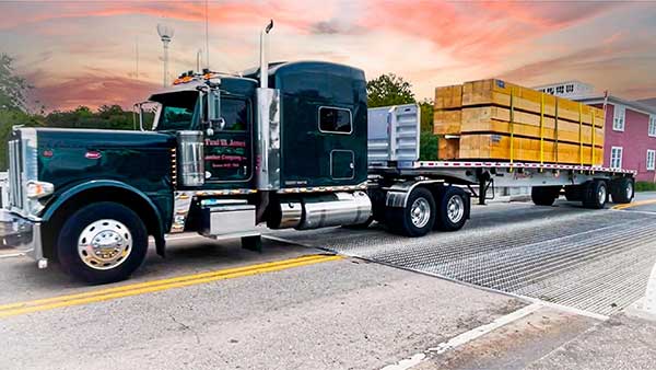 a Paul Jones Lumber truck hauls lumber