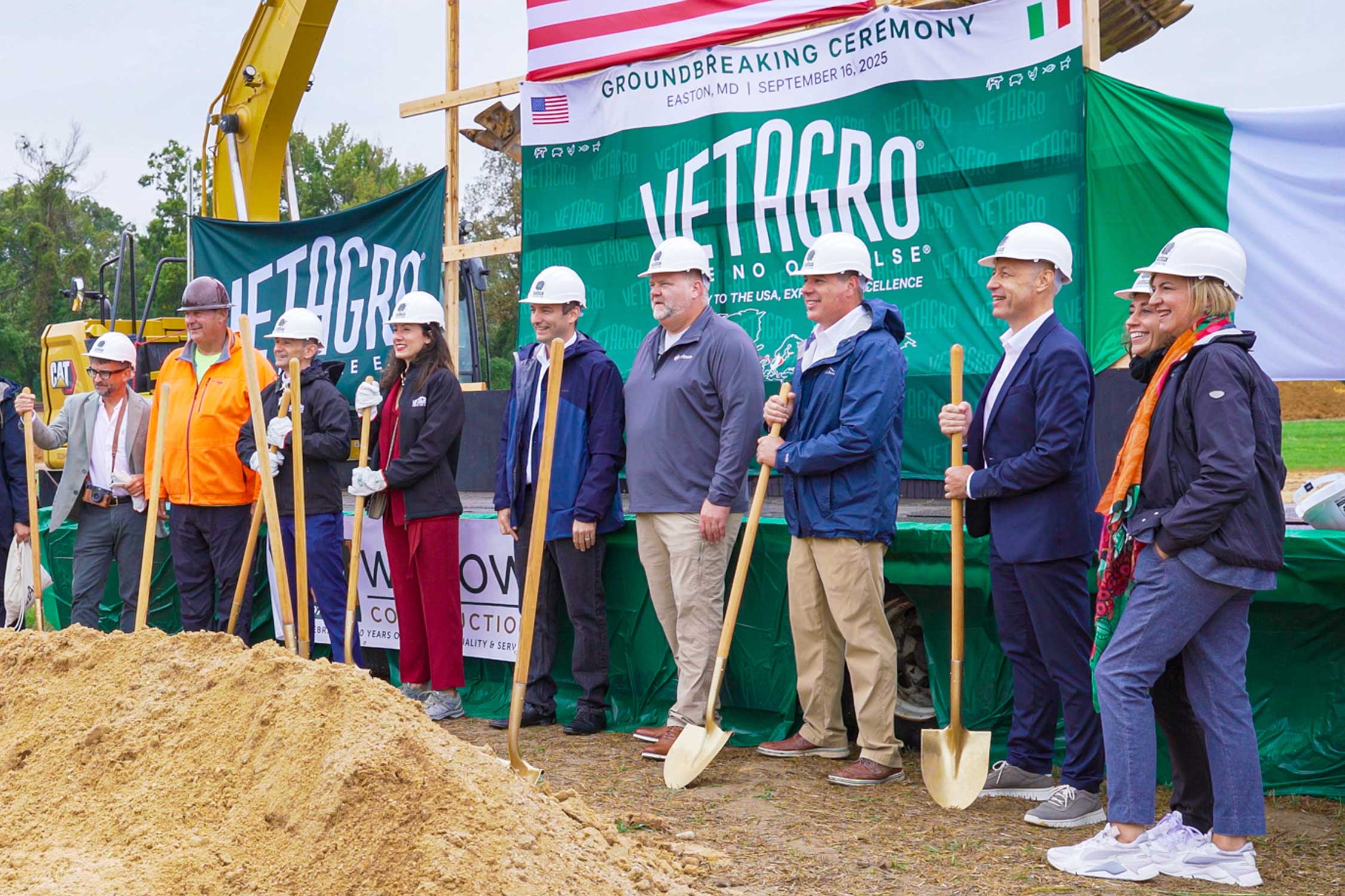 Vetagro company officials stand with shovels at the ground breaking event in Easton