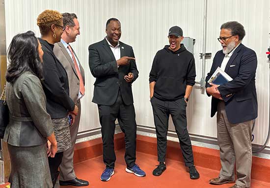 Maryland Commerce Secretary Harry Coker and Howard County Executive Calvin Ball tour the new Feast & Fettle facility in Maryland
