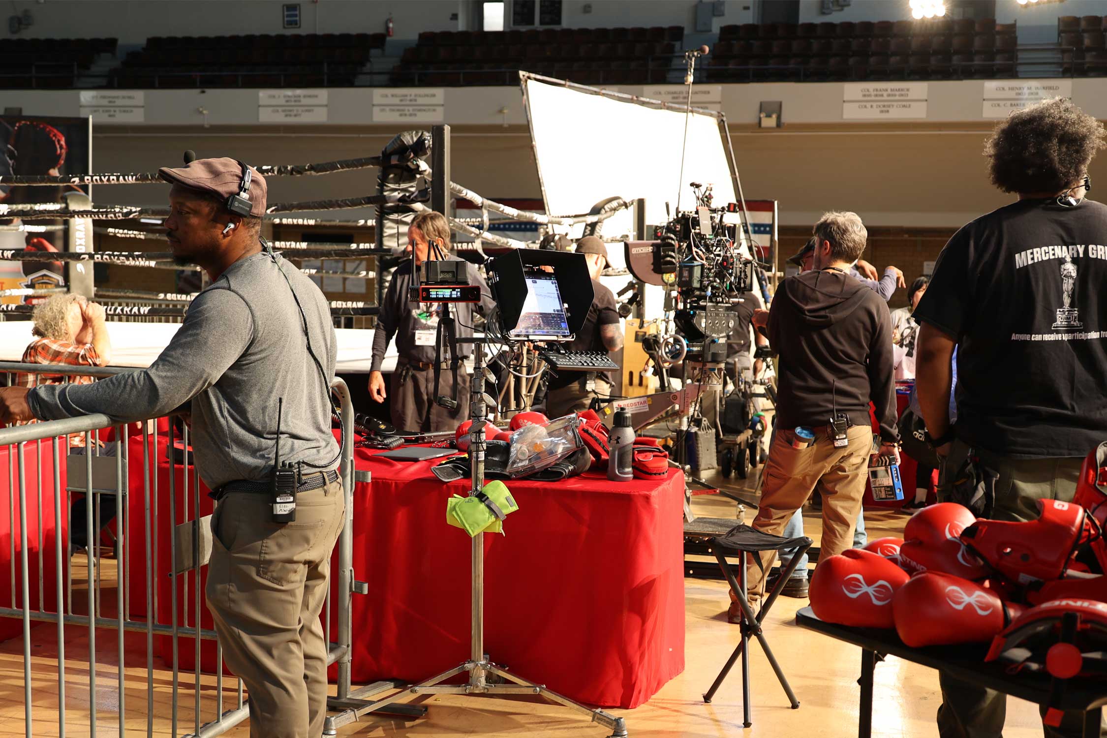 a camera crew setting up on a film set
