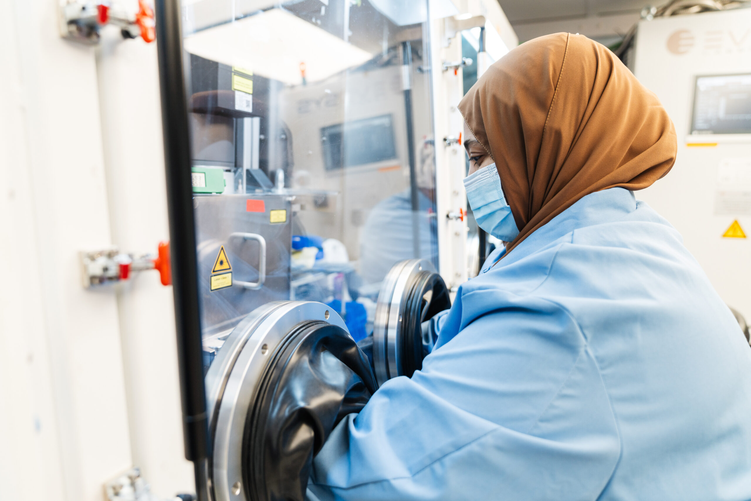 woman working on a machine in