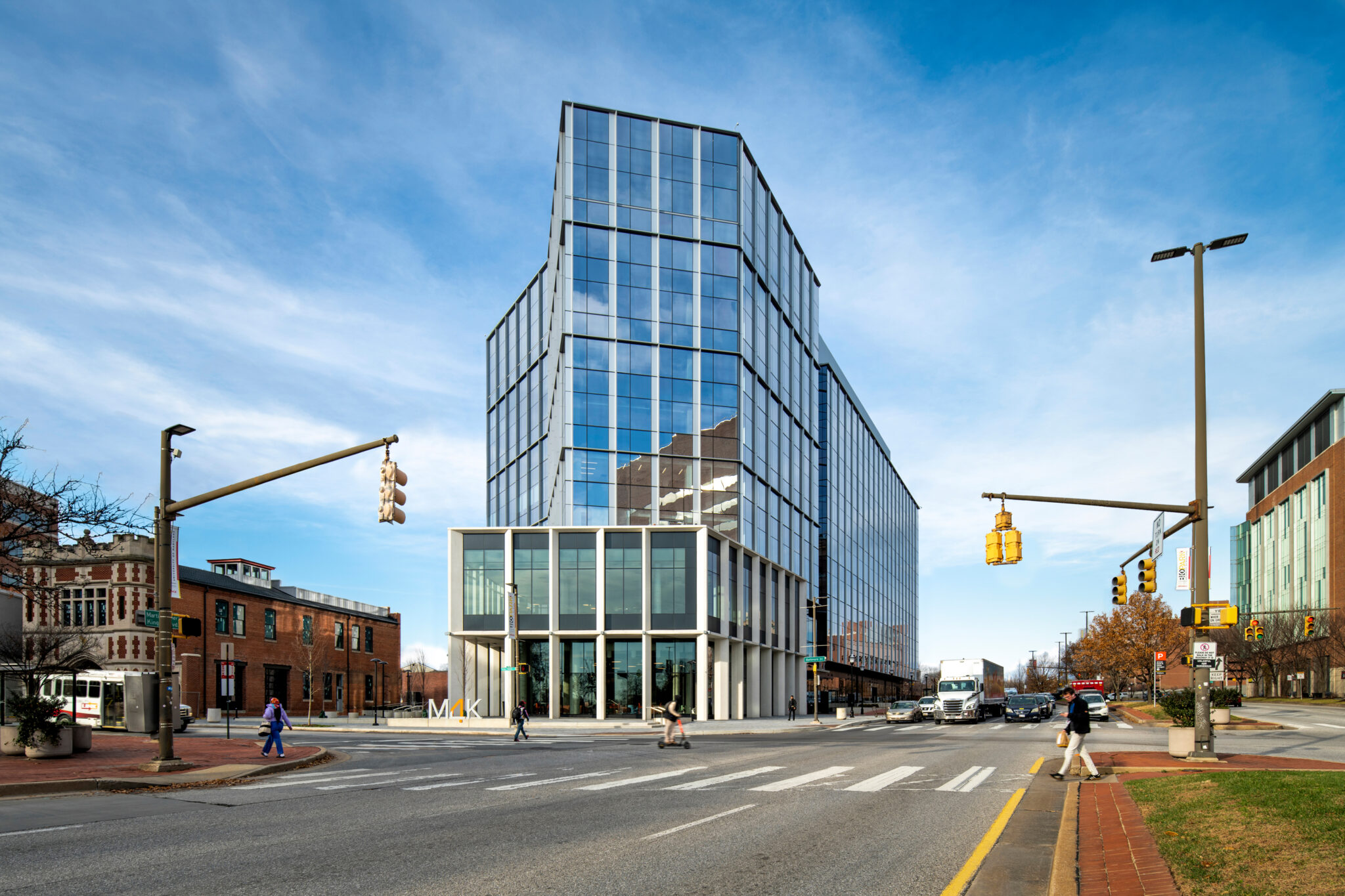 a building in the city with people walking across the street