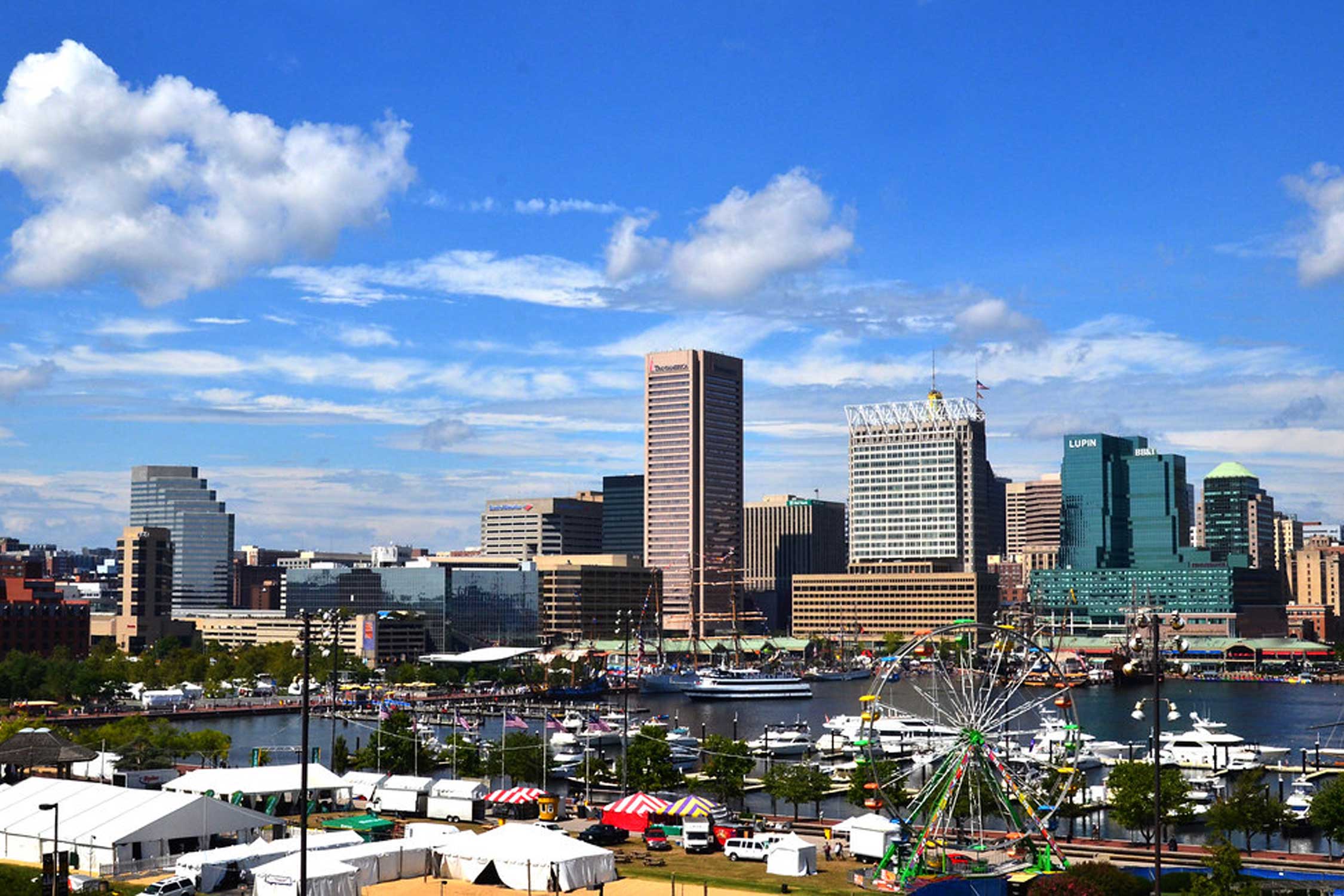 the baltimore skyline with a blue cloudy sky