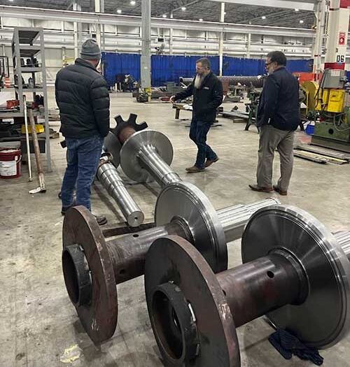 Touring Pillar Innovations factory space, walking around large metal machine components