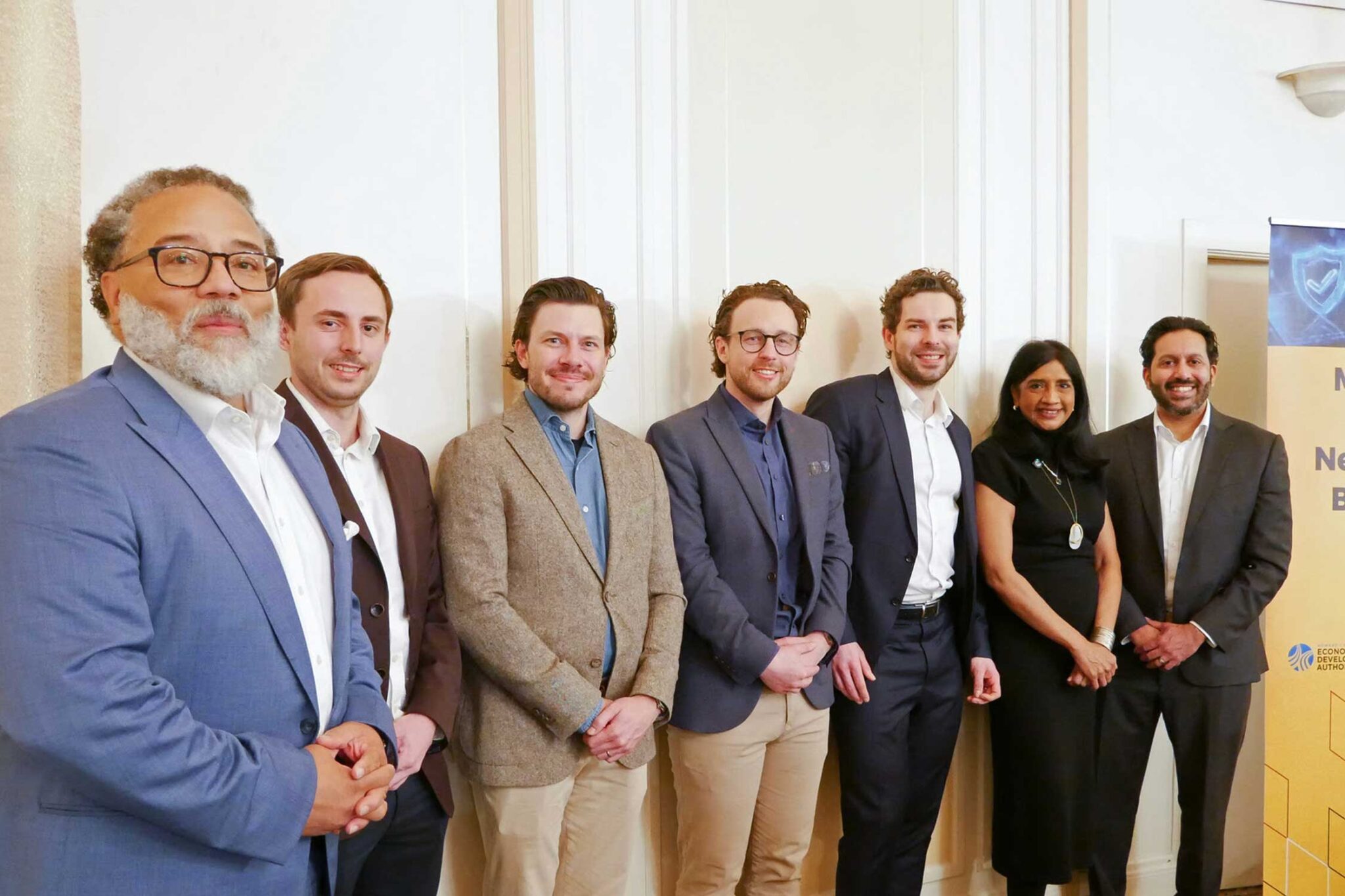 Leadership from Risk Ledger company poses for a photo with Commerce Secretary Harry Coker and Lt. Governor Aruna Miller
