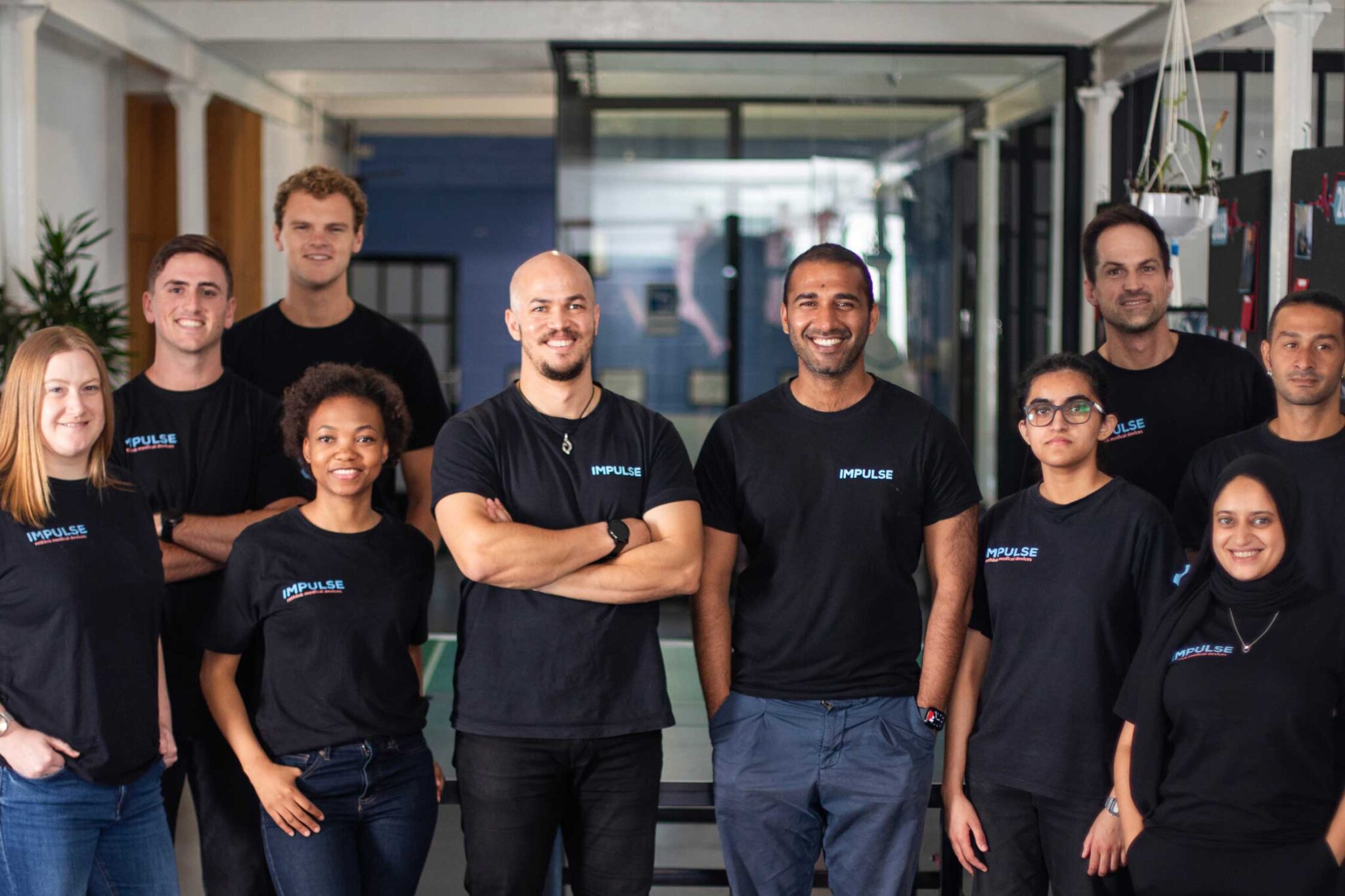 South African business Impulse Bio poses for a photo wearing matching black shirts