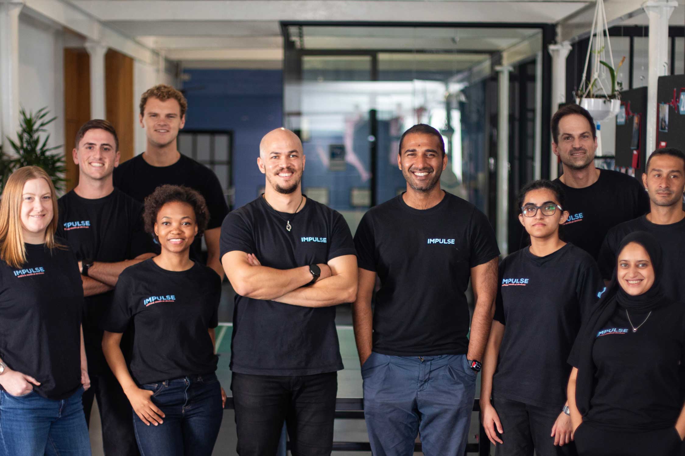 South African business Impulse Bio poses for a photo wearing matching black shirts