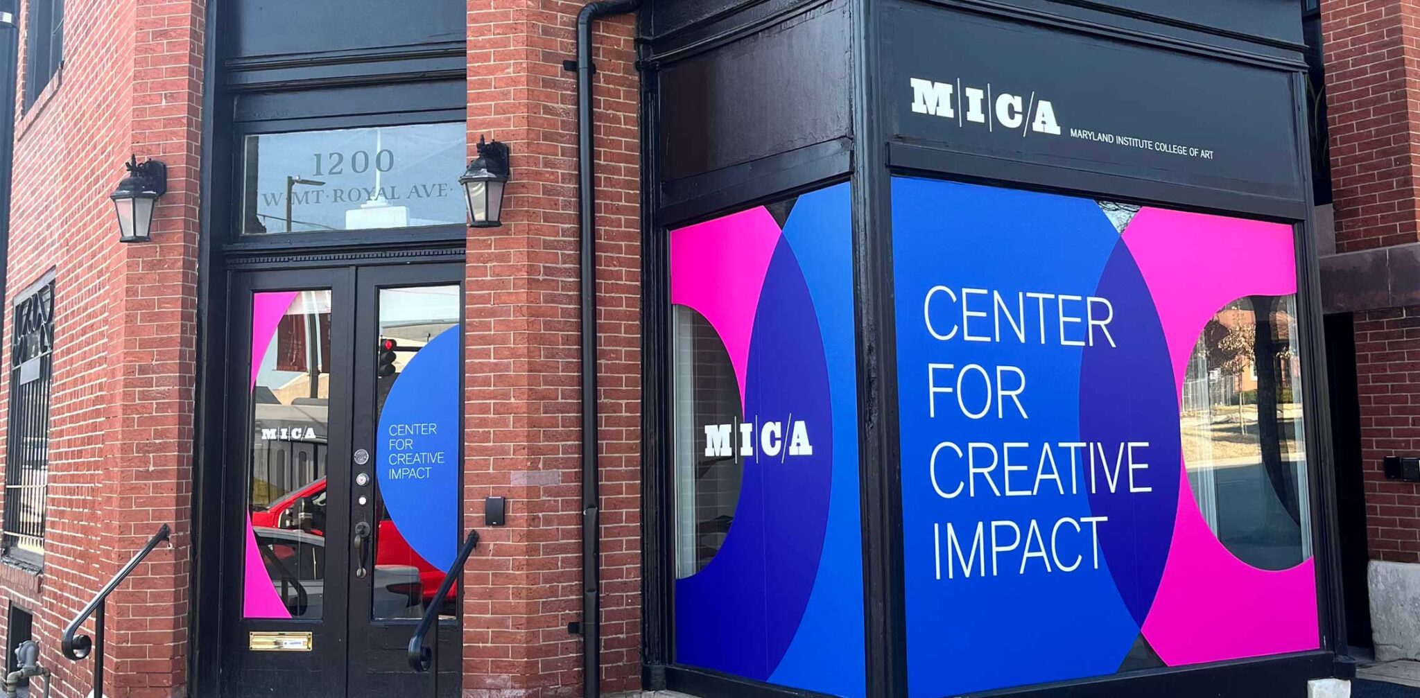 an LED screen says "center for creative impact" outside the Maryland Institute College of Art