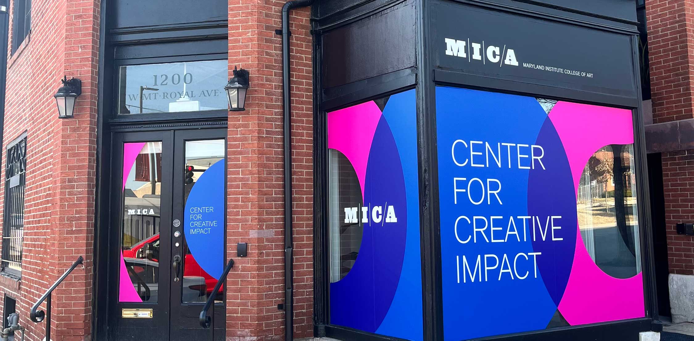 an LED screen says "center for creative impact" outside the Maryland Institute College of Art