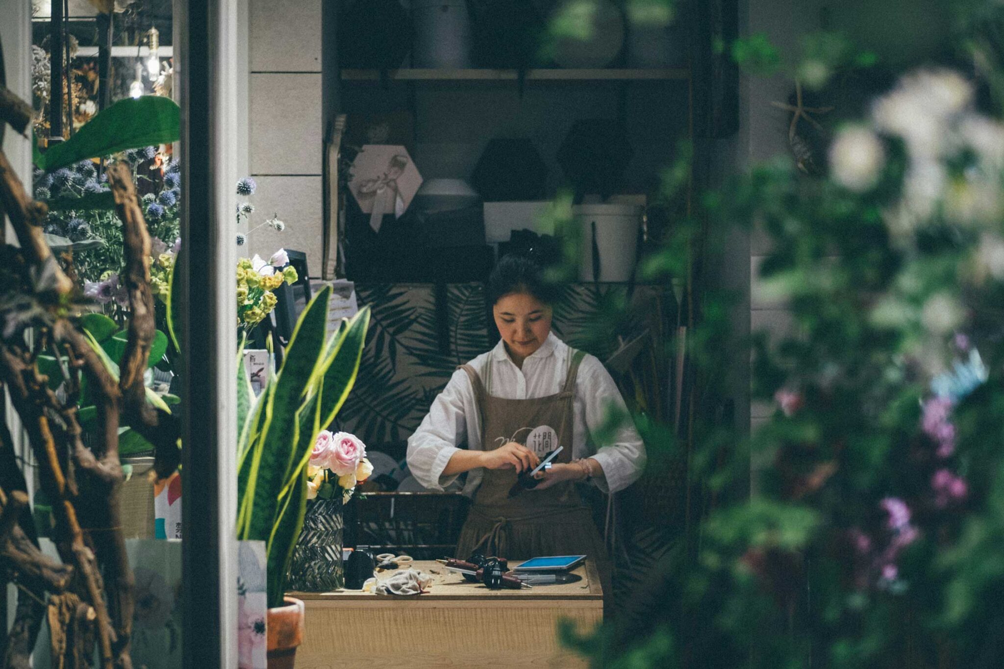 a small business worker inside of a plant shop